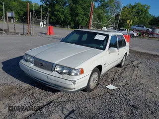 1998 Volvo S90 with VIN YV1KS9605W1129198, listed as a IAAI auction lot 42153215 with 257,242 mi miles. Bid and sale history available at carsss.com. Image 2.