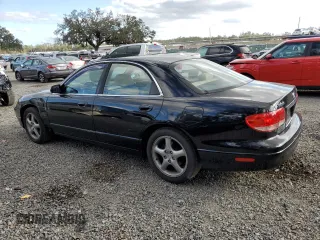 2002 Mazda Millenia z VIN JM1TA221421729790, wystawiony jako Copart lot #84460794 z przebiegiem 68 102 mil mil oraz Szkody całkowita. Historia ofert i sprzedaży dostępna na DreamBid. Obrazek 2.