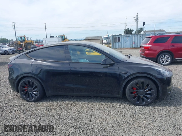 2022 Tesla Model Y Performance z VIN 7SAYGDEF5NF546680, wystawiony jako IAAI lot #42229359 z przebiegiem 55 597 mil mil oraz . Historia ofert i sprzedaży dostępna na DreamBid. Obrazek 13.