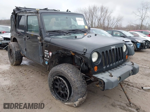 2008 Jeep Wrangler Unlimited X with VIN 1J4GA39138L641138, listed as a IAAI auction lot 41986230 with 215,026 mi miles. Bid and sale history available at carsss.com. Image 1.