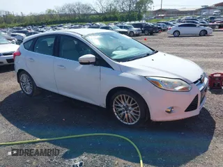 2012 Ford Focus SEL with VIN 1FAHP3M21CL413436, listed as a IAAI auction lot 42011706 with 392,754 mi miles. Bid and sale history available at carsss.com. Image 1.