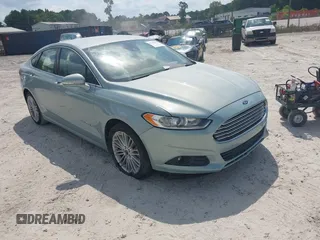 2013 Ford Fusion SE Hybrid z VIN 3FA6P0LU8DR265460, wystawiony jako IAAI lot #42720385 z przebiegiem 146 179 mil mil oraz . Historia ofert i sprzedaży dostępna na DreamBid. Obrazek 1.