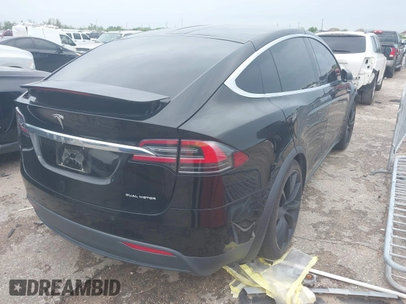 2021 Tesla Model X Long Range Plus with VIN 5YJXCAE27MF324270, listed as a IAAI auction lot 41886101 with 59,614 mi miles and . Bid and sale history available at carsss.com. Image 4.