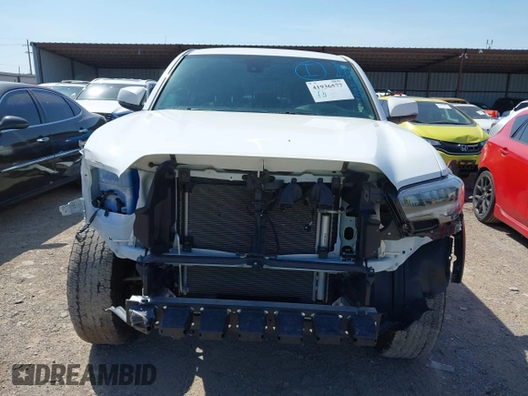 2023 Toyota Tacoma SR z VIN 3TYCZ5AN5PT151681, wystawiony jako IAAI lot #41936577 z przebiegiem 30 056 mil mil oraz . Historia ofert i sprzedaży dostępna na DreamBid. Obrazek 13.