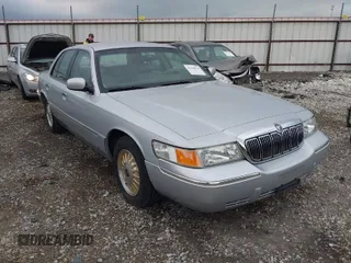 1999 Mercury Grand Marquis LS with VIN 2MEFM75W0XX670050, listed as a IAAI auction lot 41938610 with 65,460 mi miles and . Bid and sale history available at DreamBid. Image 1.