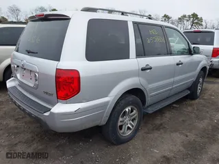 2004 Honda Pilot EX with VIN 2HKYF18494H525047, listed as a IAAI auction lot 41927610 with 999,999 mi miles. Bid and sale history available at carsss.com. Image 4.
