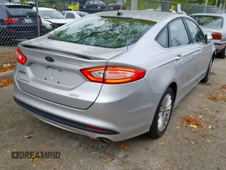 2016 Ford Fusion SE Hybrid with VIN 3FA6P0LUXGR397589, listed as a Copart auction lot 58180612 with 72,400 mi miles and Salvage Title. Bid and sale history available at carsss.com. Image 4.