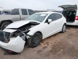 2014 Mazda 3 i Sport with VIN JM1BM1K77E1204339, listed as a IAAI auction lot 41593197 with 94,656 mi miles and . Bid and sale history available at carsss.com. Image 2.