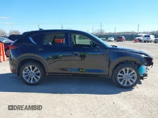 2020 Mazda CX-5 Grand Touring with VIN JM3KFBDMXL0763316, listed as a IAAI auction lot 41661958 with 64,881 mi miles and . Bid and sale history available at carsss.com. Image 14.
