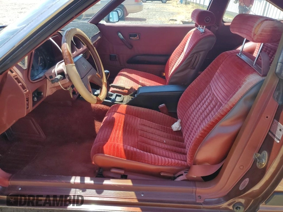 1982 Datsun 280ZX 2+2 z VIN JN1HZ06S5CX429361, wystawiony jako Copart lot #59239365 z przebiegiem 139 002 mil mil oraz Tytuł czysty. Historia ofert i sprzedaży dostępna na DreamBid. Obrazek 7.