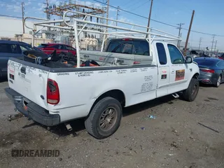 2002 Ford F-150 XL with VIN 1FTRX17L82NA54581, listed as a IAAI auction lot 41698662 with 220,321 mi miles. Bid and sale history available at carsss.com. Image 4.