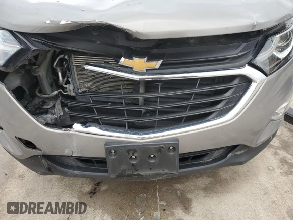 2018 Chevrolet Equinox LT z VIN 3GNAXJEV6JS504130, wystawiony jako Copart lot #87847015 z przebiegiem Nie podano mil oraz Szkoda całkowita • Salvage title. Historia ofert i sprzedaży dostępna na DreamBid. Obrazek 12.