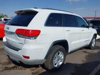 2014 Jeep Grand Cherokee Laredo with VIN 1C4RJEAG3EC125478, listed as a IAAI auction lot 41938499 with 167,588 mi miles and . Bid and sale history available at DreamBid. Image 4.
