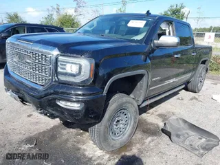 2017 GMC Sierra 1500 Denali with VIN 3GTU2PEJ7HG309560, listed as a IAAI auction lot 40764302 with 154,061 mi miles. Bid and sale history available at carsss.com. Image 2.