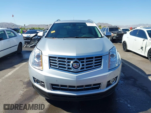 2013 Cadillac SRX Premium Collection z VIN 3GYFNEE36DS556446, wystawiony jako IAAI lot #42289824 z przebiegiem 23 988 mil mil oraz . Historia ofert i sprzedaży dostępna na DreamBid. Obrazek 13.