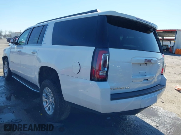 2019 GMC Yukon XL SLT with VIN 1GKS1GKC0KR330715, listed as a IAAI auction lot 41758626 with 134,641 mi miles. Bid and sale history available at carsss.com. Image 3.