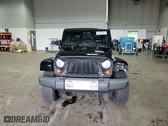 2012 Jeep Wrangler Unlimited Sahara with VIN 1C4BJWEG8CL235893, listed as a Copart auction lot 58195585 with 142,179 mi miles and Salvage title. Bid and sale history available at DreamBid. Image 14.