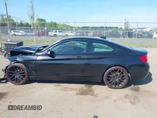 2015 BMW 4 Series 428i xDrive with VIN WBA3N9C59FK248249, listed as a IAAI auction lot 42140141 with 106,916 mi miles and . Bid and sale history available at DreamBid. Image 14.