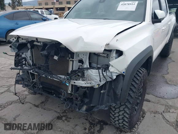 2021 Toyota Tacoma SR5 z VIN 3TMDZ5BN2MM100245, wystawiony jako IAAI lot #42078914 z przebiegiem 58 153 mil mil oraz . Historia ofert i sprzedaży dostępna na DreamBid. Obrazek 6.