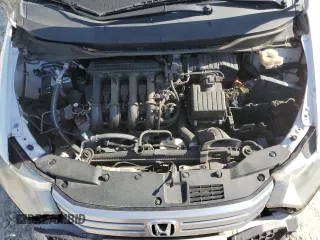2010 Honda Insight EX z VIN JHMZE2H77AS035113, wystawiony jako Copart lot #54179005 z przebiegiem 165 083 mil mil oraz Szkoda całkowita • Salvage title. Historia ofert i sprzedaży dostępna na DreamBid. Obrazek 11.