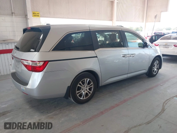 2012 Honda Odyssey EX-L with VIN 5FNRL5H67CB005013, listed as a IAAI auction lot 42295586 with 200,611 mi miles and . Bid and sale history available at DreamBid. Image 4.