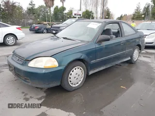 1997 Honda Civic DX with VIN 1HGEJ6128VL023684, listed as a IAAI auction lot 41502999 with 140,871 mi miles. Bid and sale history available at carsss.com. Image 2.