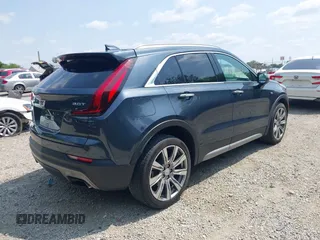2019 Cadillac XT4 FWD Premium Luxury z VIN 1GYFZCR43KF143980, wystawiony jako IAAI lot #42472400 z przebiegiem 36 496 mil mil oraz . Historia ofert i sprzedaży dostępna na DreamBid. Obrazek 4.