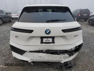 2023 BMW iX xDrive50 with VIN WB523CF04PCL67044, listed as a Copart auction lot 82805014 with 12,858 mi miles and Salvage Title. Bid and sale history available at carsss.com. Image 6.