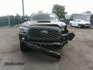2021 Toyota Tacoma SR z VIN 3TYCZ5AN7MT017377, wystawiony jako IAAI lot #42285326 z przebiegiem 91 657 mil mil oraz . Historia ofert i sprzedaży dostępna na DreamBid. Obrazek 12.