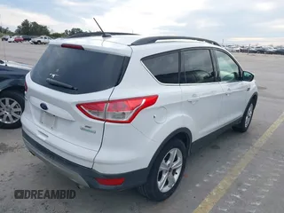 2015 Ford Escape SE with VIN 1FMCU0GX2FUB33893, listed as a IAAI auction lot 41455605 with 128,383 mi miles. Bid and sale history available at carsss.com. Image 4.