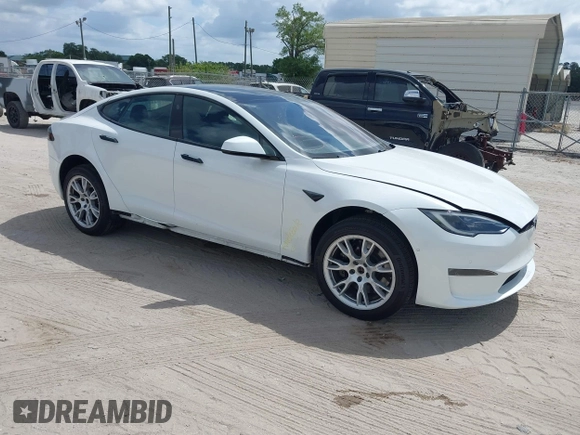 2022 Tesla Model S Plaid with VIN 5YJSA1E6XNF473888, listed as a IAAI auction lot 42141141 with 28,584 mi miles and . Bid and sale history available at carsss.com. Image 1.