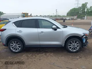 2021 Mazda CX-5 Grand Touring with VIN JM3KFBDM4M0371496, listed as a IAAI auction lot 42428860 with 113,735 mi miles and . Bid and sale history available at DreamBid. Image 14.