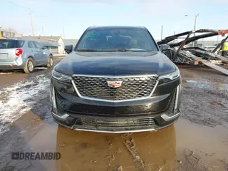 2025 Cadillac XT6 FWD Premium Luxury with VIN 1GYKPCRS6SZ104902, listed as a IAAI auction lot 41565224 with 4,735 mi miles. Bid and sale history available at carsss.com. Image 12.