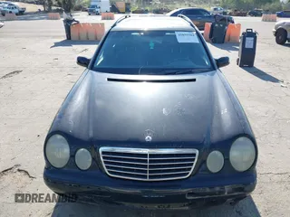 2001 Mercedes-Benz E-Class with VIN WDBJH65J31B381879, listed as a IAAI auction lot 41855504 with 153,667 mi miles. Bid and sale history available at carsss.com. Image 6.