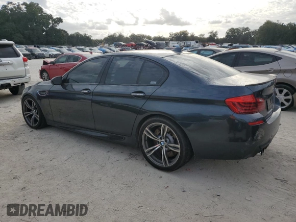 2016 BMW M5 z VIN WBSFV9C51GD595430, wystawiony jako Copart lot #79675834 z przebiegiem 82 351 mil mil oraz Szkoda całkowita • Salvage title. Historia ofert i sprzedaży dostępna na DreamBid. Obrazek 2.