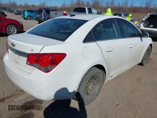 2014 Chevrolet Cruze 1LT z VIN 1G1PC5SB2E7260845, wystawiony jako IAAI lot #41847899 z przebiegiem 87 720 mil mil oraz . Historia ofert i sprzedaży dostępna na DreamBid. Obrazek 4.