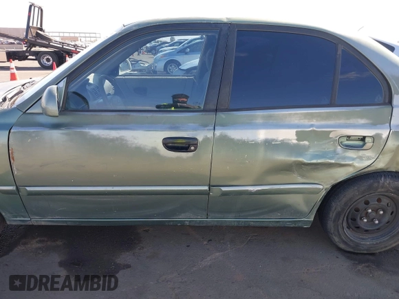 2005 Hyundai Accent GLS with VIN KMHCG45C95U620716, listed as a IAAI auction lot 41740573 with 187,971 mi miles. Bid and sale history available at carsss.com. Image 15.