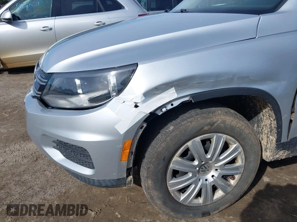 2012 Volkswagen Tiguan with VIN WVGCV7AX6CW589605, listed as a IAAI auction lot 41916090 with 123,223 mi miles and . Bid and sale history available at DreamBid. Image 13.