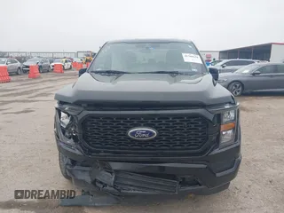 2023 Ford F-150 XL with VIN 1FTEW1C55PKD01184, listed as a IAAI auction lot 41700658 with 18,804 mi miles. Bid and sale history available at carsss.com. Image 12.