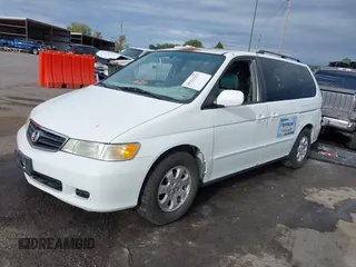 2004 Honda Odyssey EX-L with VIN 5FNRL18074B109717, listed as a IAAI auction lot 37731273 with 314,449 mi miles and . Bid and sale history available at DreamBid. Image 2.