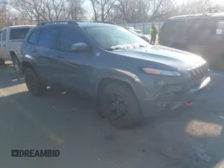 2015 Jeep Cherokee Trailhawk z VIN 1C4PJMBS3FW510219, wystawiony jako IAAI lot #41440297 z przebiegiem 144 012 mil mil oraz . Historia ofert i sprzedaży dostępna na DreamBid. Obrazek 1.