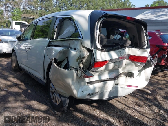 2014 Honda Odyssey EX-L with VIN 5FNRL5H63EB064854, listed as a IAAI auction lot 42102704 with 148,536 mi miles and . Bid and sale history available at carsss.com. Image 3.