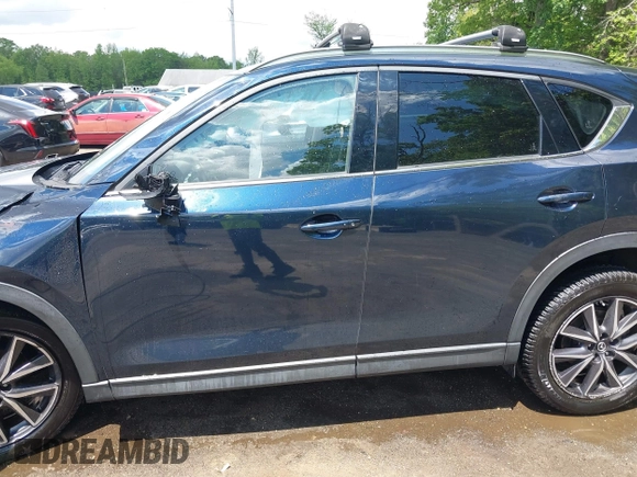 2018 Mazda CX-5 Grand Touring with VIN JM3KFBDM2J0373386, listed as a IAAI auction lot 42200795 with 70,111 mi miles and . Bid and sale history available at DreamBid. Image 15.