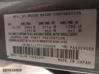 2005 Mazda Mazda3 s with VIN JM1BK143751300889, listed as a IAAI auction lot 40939709 with NaN miles. Bid and sale history available at carsss.com. Image 9.