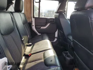 2013 Jeep Wrangler Unlimited Sport z VIN 1C4HJWDG9DL581643, wystawiony jako Copart lot #60775805 z przebiegiem 148 959 mil mil oraz Czysty tytuł • Clean title. Historia ofert i sprzedaży dostępna na DreamBid. Obrazek 11.