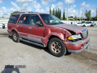 1999 Lincoln Navigator z VIN 5LMRU27A2XLJ41370, wystawiony jako Copart lot #72879004 z przebiegiem Nie podano mil oraz Szkoda całkowita • Salvage title. Historia ofert i sprzedaży dostępna na DreamBid. Obrazek 4.