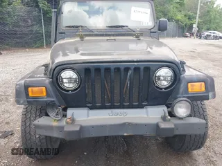 2004 Jeep Wrangler Sport z VIN 1J4FA49S94P792689, wystawiony jako IAAI lot #42394196 z przebiegiem Nie podano mil oraz . Historia ofert i sprzedaży dostępna na DreamBid. Obrazek 6.