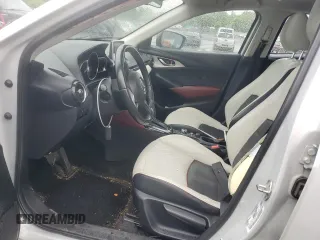 2016 Mazda CX-3 Grand Touring z VIN JM1DKBD77G0105451, wystawiony jako Copart lot #58341495 z przebiegiem 109 525 mil mil oraz Szkody całkowita. Historia ofert i sprzedaży dostępna na DreamBid. Obrazek 7.