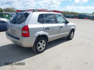 2005 Hyundai Tucson GL with VIN KM8JM12B75U075660, listed as a IAAI auction lot 42037735 with 157,453 mi miles. Bid and sale history available at carsss.com. Image 4.