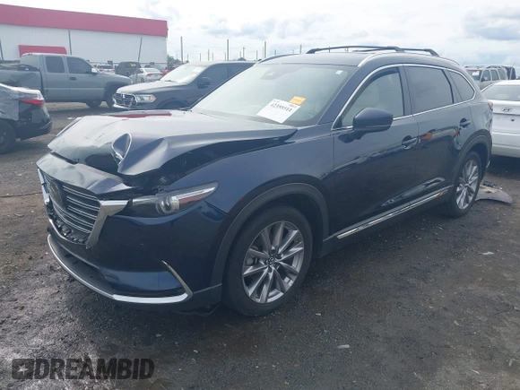 2020 Mazda CX-9 Grand Touring with VIN JM3TCBDY1L0402718, listed as a IAAI auction lot 42355511 with 87,205 mi miles and . Bid and sale history available at DreamBid. Image 18.